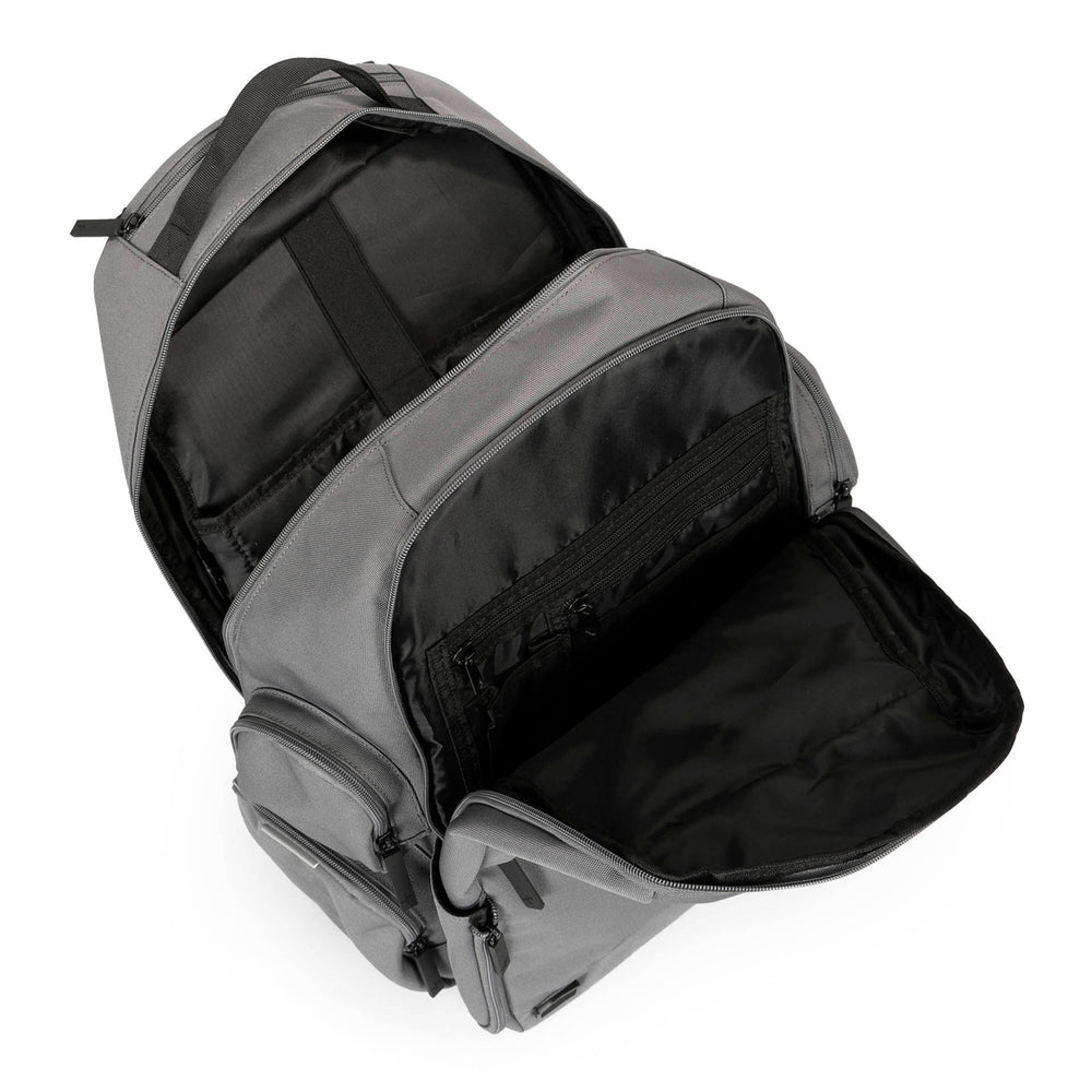 Over head view of a grey laptop backpack called Cartier 3.0 designed by Tracker on a white background, showcasing 3 side zipper pockets, a top handle, 2 opened main compartments, revealing its laptop compartment.