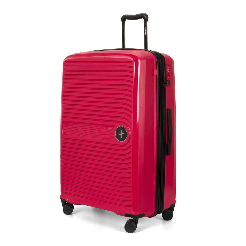 Angle view of a red luggage called Dynamo designed by Tracker showing its telescopic handle, lined-pattern shell, spinner wheels, and tracker symbol embossed on the front.