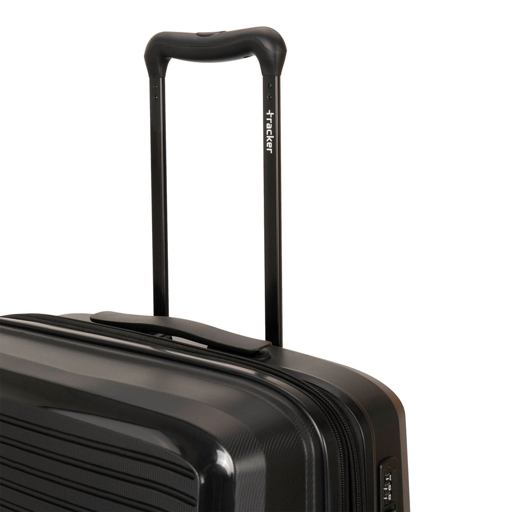 Close up of a black luggage called Dynamo designed by Tracker showing its telescopic handle with the brand logo printed on it.