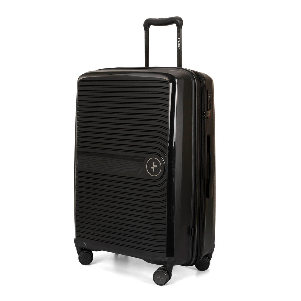 Angle view of a black 25" luggage called Dynamo designed by Tracker showing its telescopic handle, lined-pattern shell, spinner wheels and tracker symbol embossed on the front.