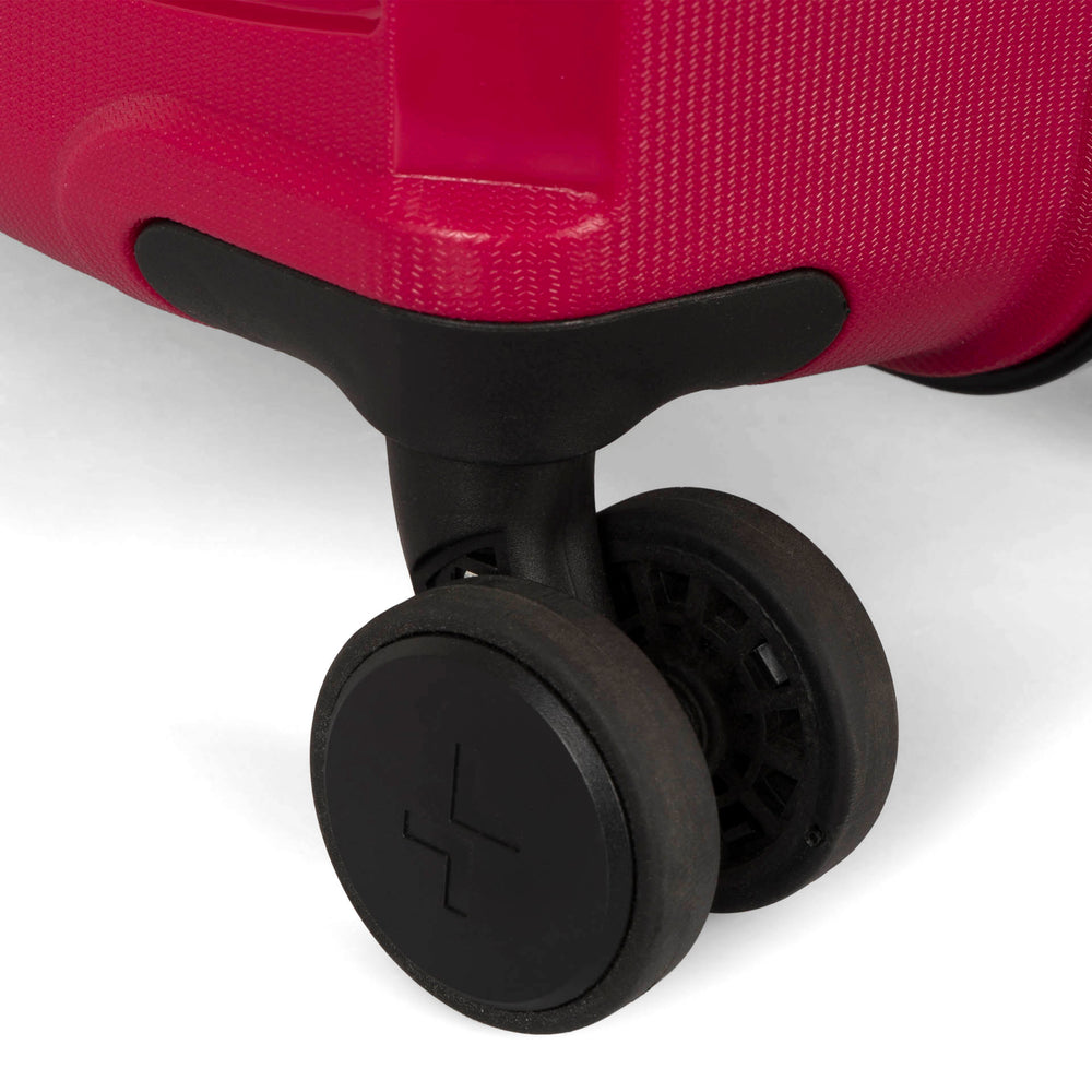 Close up view of a 25" red luggage called Dynamo designed by Tracker showing  1 of 4 spinner wheels with the tracker logo on it.