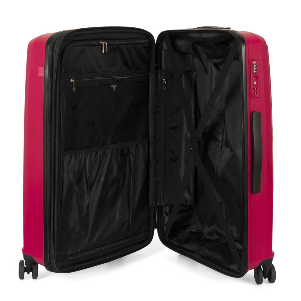 Interior view of a 25" red luggage called Dynamo designed by Tracker showing its interior brand lining, compression straps, and multiple pockets.