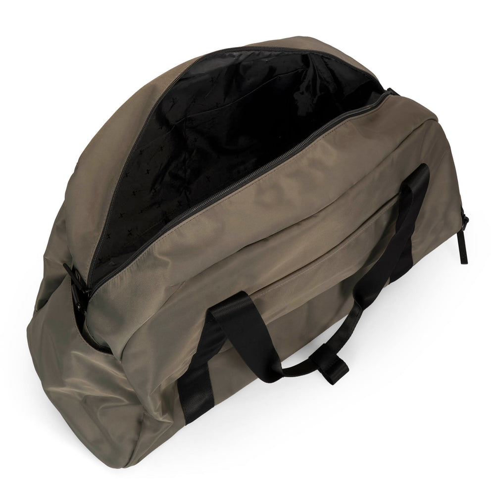 Angle view of a grey-green duffle bag called Sutton designed by Tracker on a white background, showcasing its top handle, main zipper compartment opened.