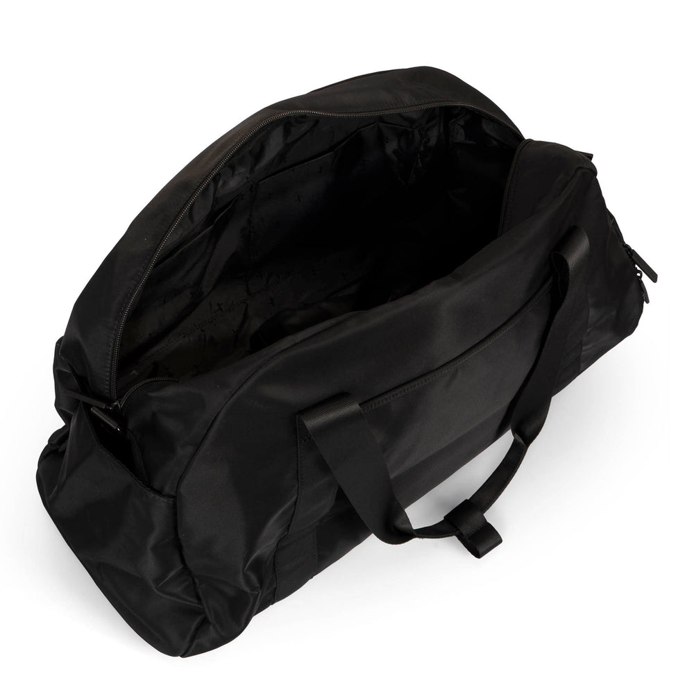 Angle view of a black duffle bag called Sutton designed by Tracker on a white background, showcasing its top handle, main zipper compartment opened.