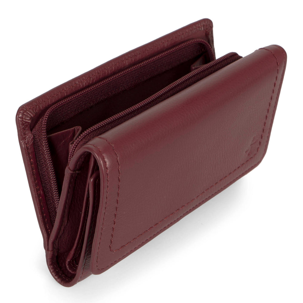 Angle interior view of a burgundy flap wallet for women called Kara designed by Tracker showing its logo, main compartment, and soft leather.