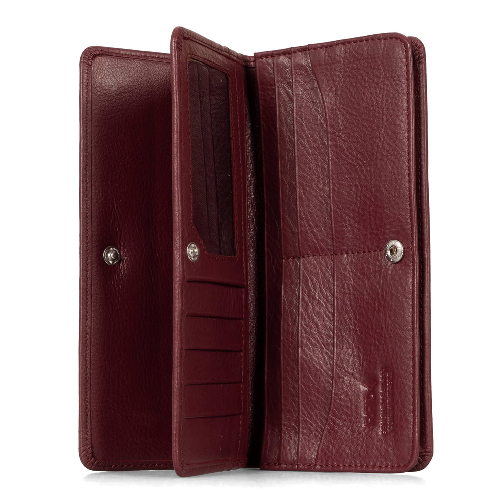 Interior view of a burgundy women's wallet called Kelly designed by Tracker showing multiple pockets, id window, and snap-button closure.