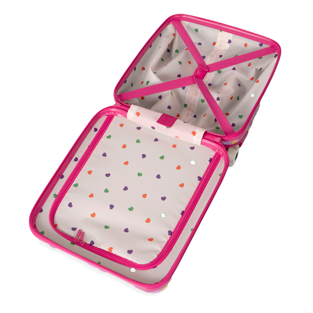 Interior of a kids luggage designed by Triforce sold at Bentley on a white background, showcasing its compression straps and white heart-print lining, pink zipper and crompression straps.