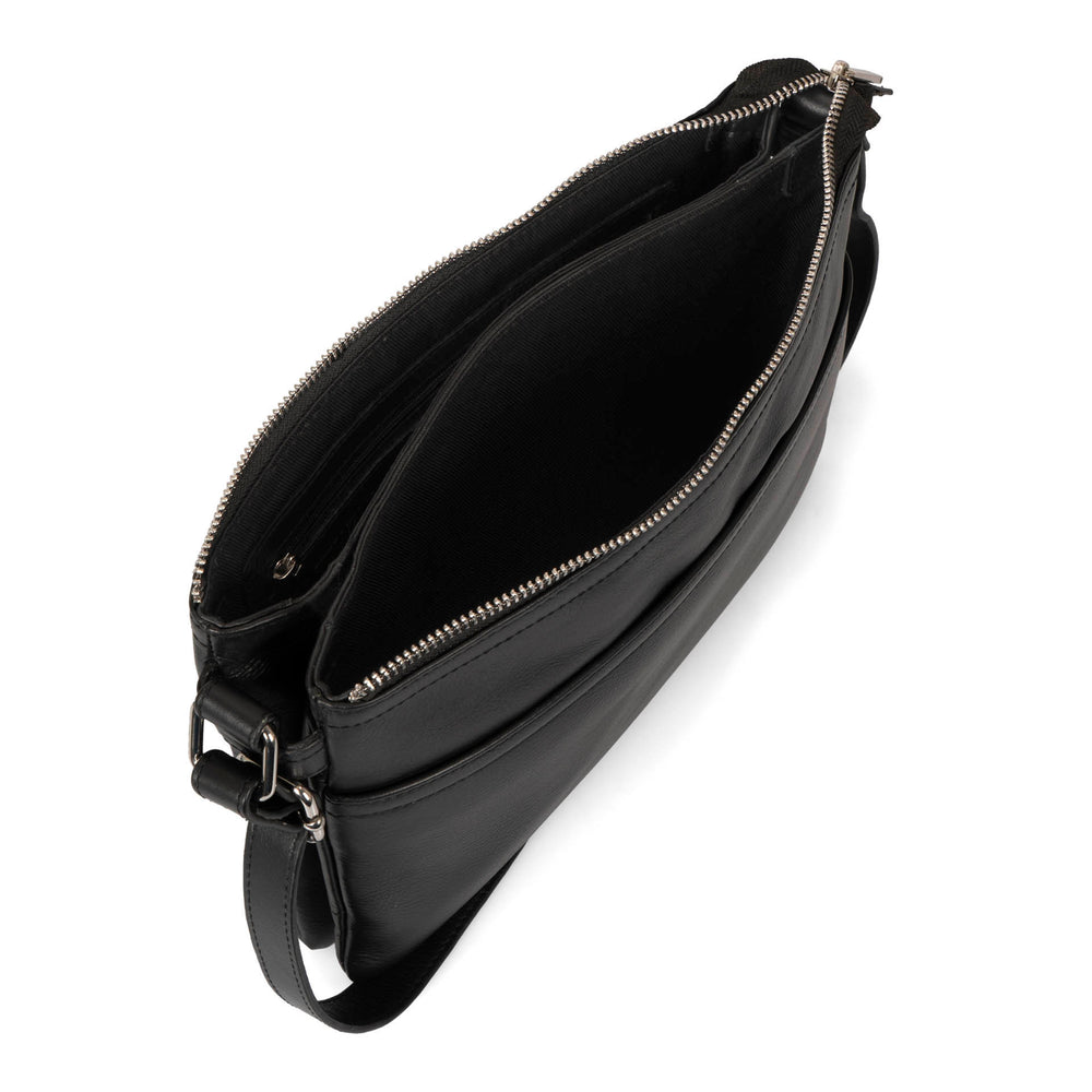 Overhead interior view of a black crossbody bag called Basics designed by Tracker showing its supple leather texture and multiple pockets.