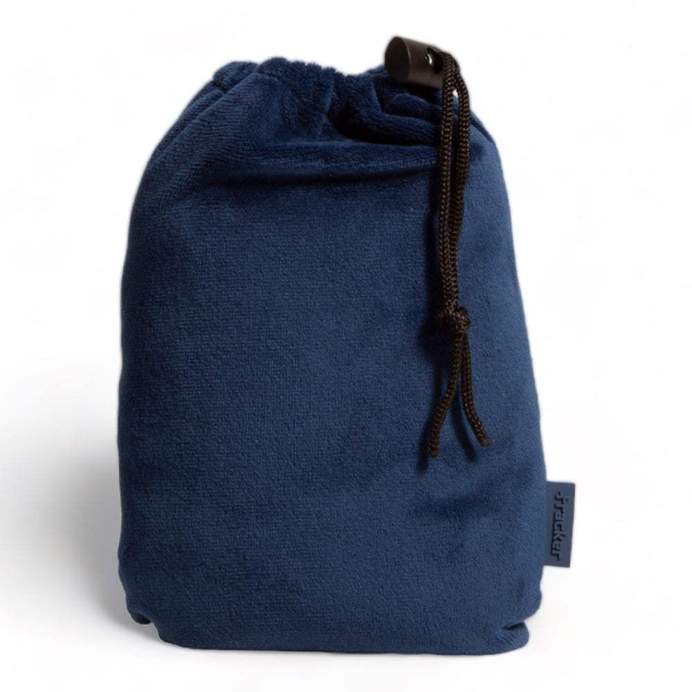 Navy blue fleece textured pouch with the drawstring dangling on its side show its tracker logo at the bottom right.